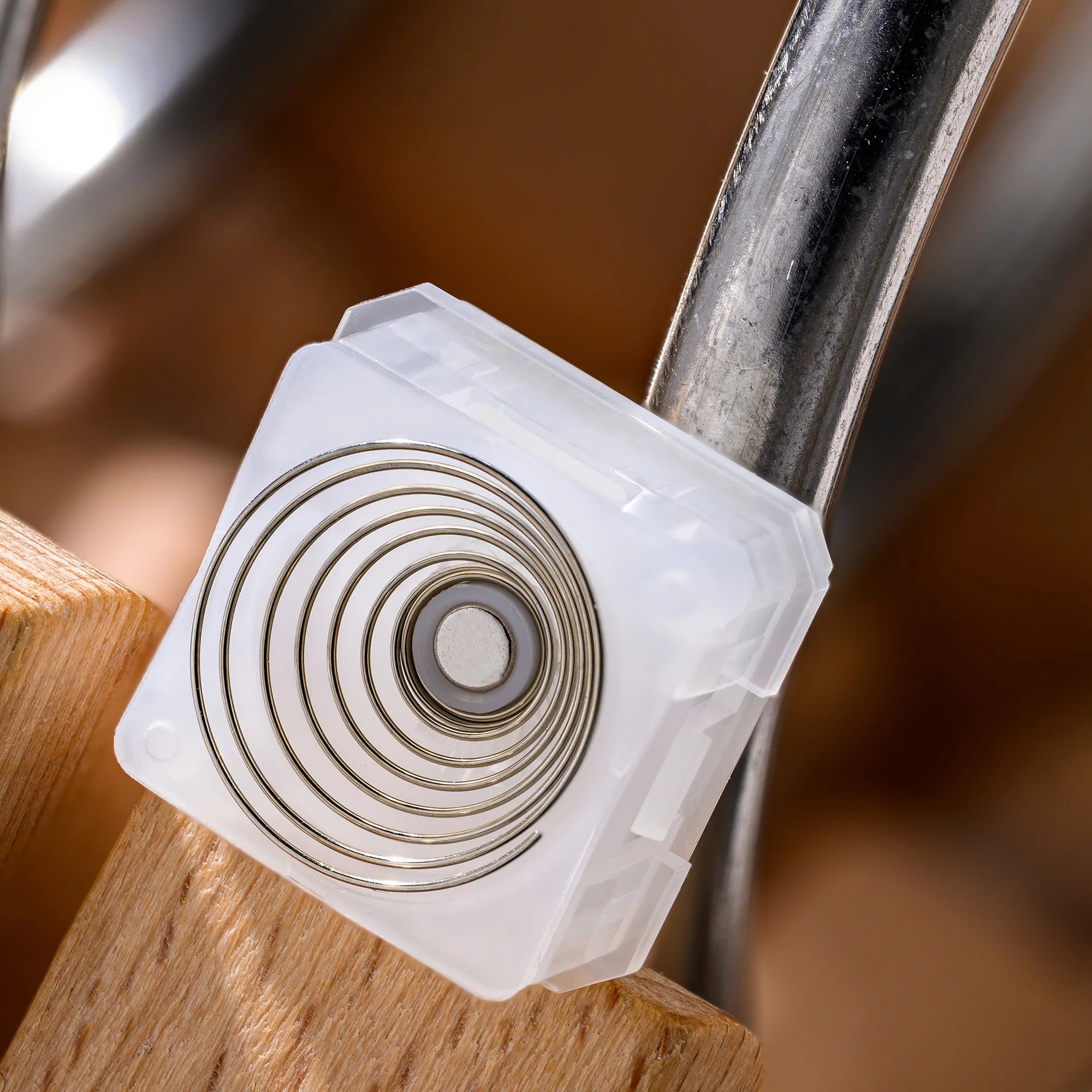 XVX Whisper switch bottom view — gold conical spring for electro-capacitive EC keyboard compatibility
